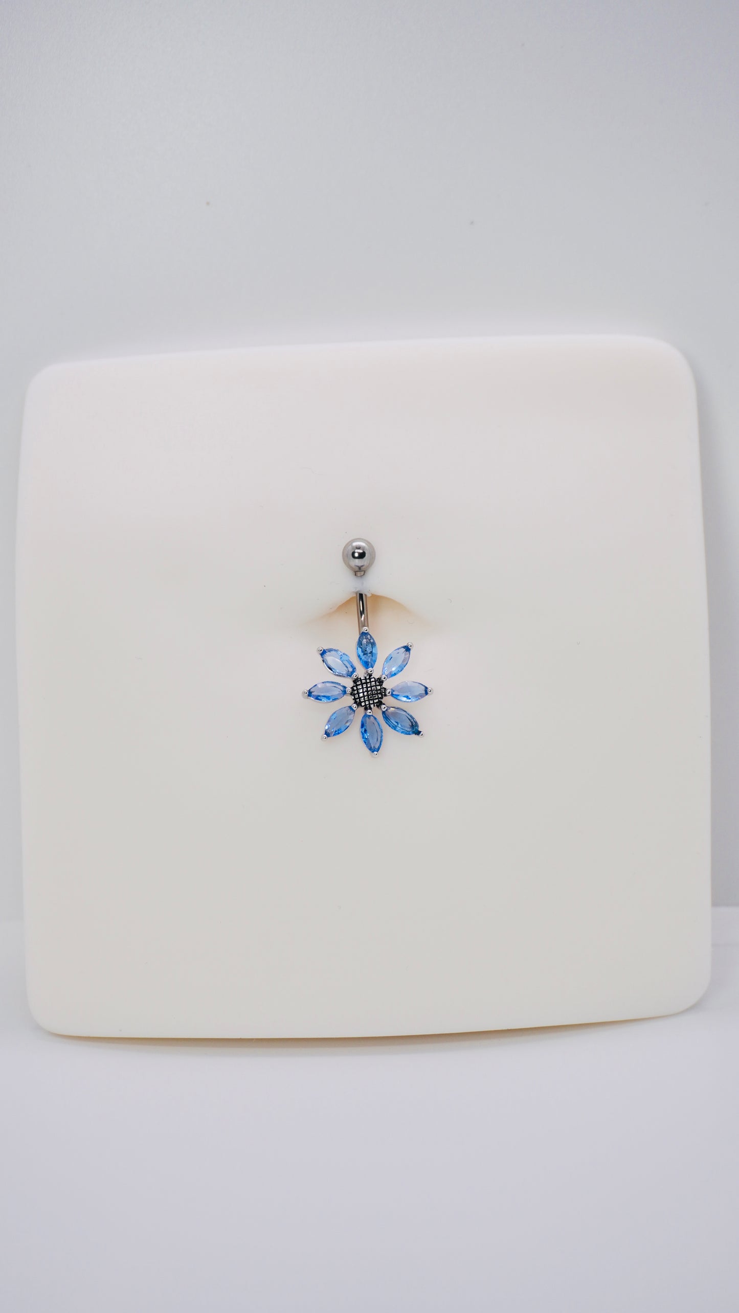 Blue flower belly ring