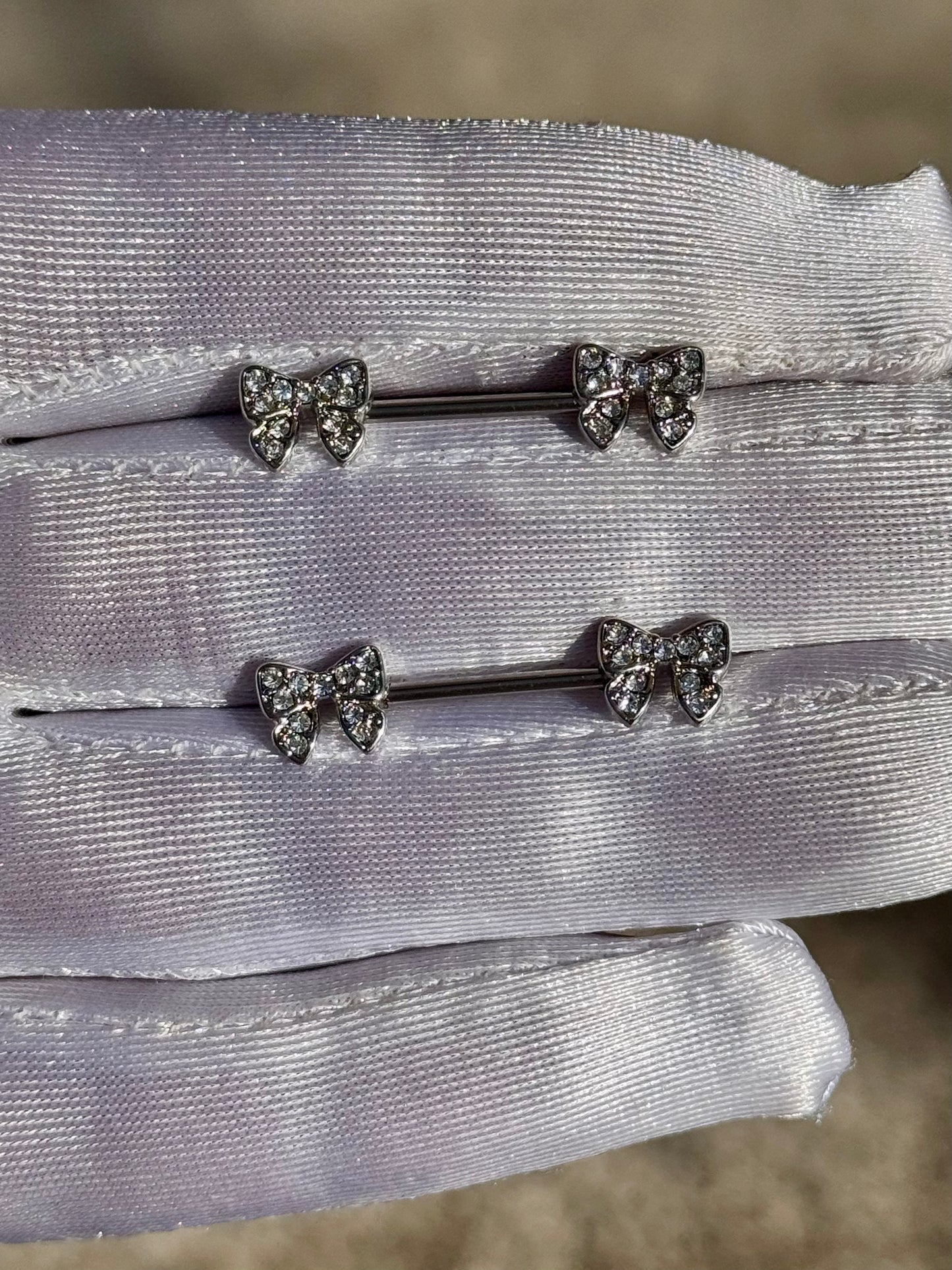 Kyliea bow nipple rings