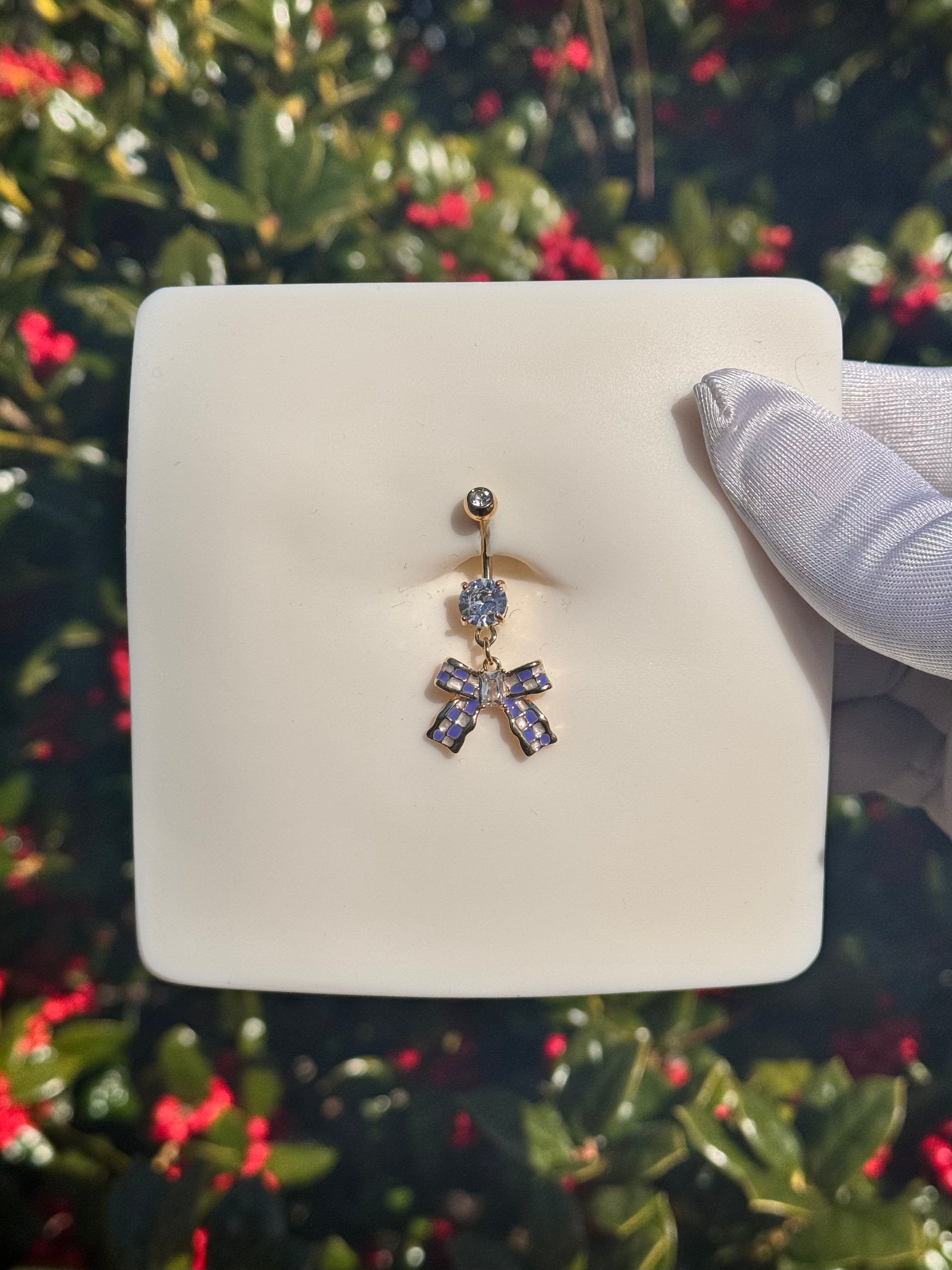 Icy bow belly ring