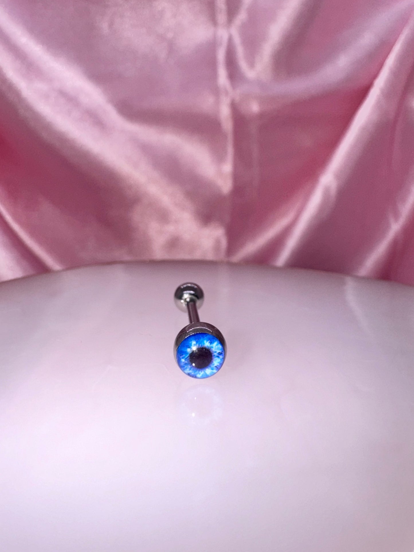 Blue eye tongue ring